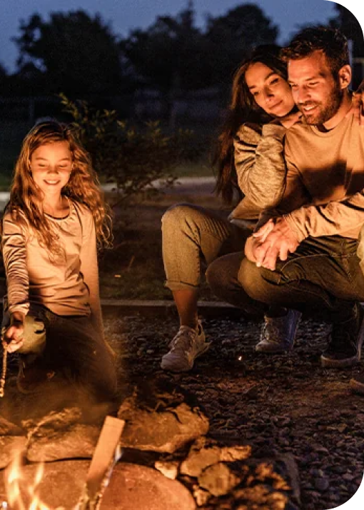 family around a campfire at night